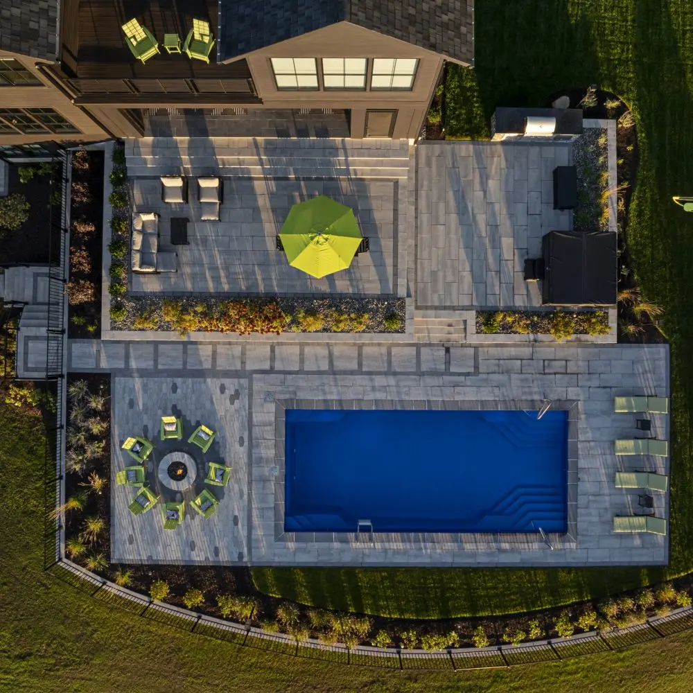 Whitsunday fiberglass pool in Ocean Shimmer installed by ProGuard Backyards in Syracuse, NY